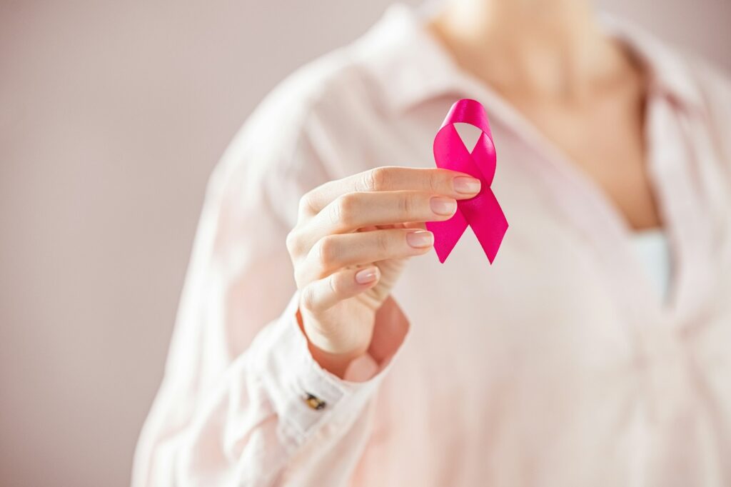 Woman Holding Pink Breast Cancer Ribbon